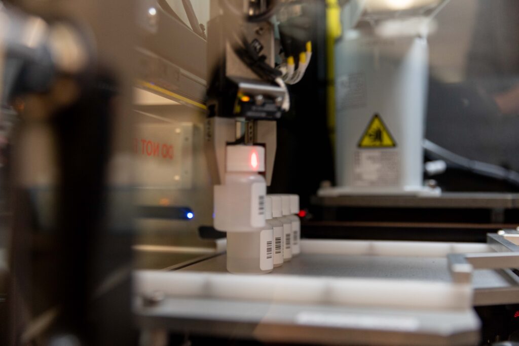 The ZING system's automated bottle-handling mechanism processes labeled medication bottles at Comprehensive Healthcare's Yakima clinic.