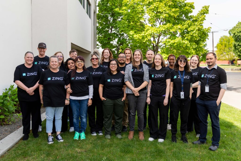 Comprehensive Healthcare Opioid Treatment Program staff celebrate the launch of the ZING robotic methadone dosing system at the Yakima clinic.
